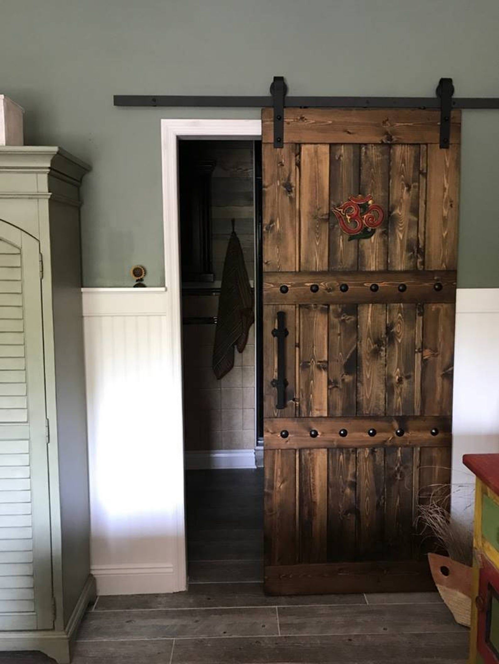 Sliding Barn Door In Gray To The Bedroom