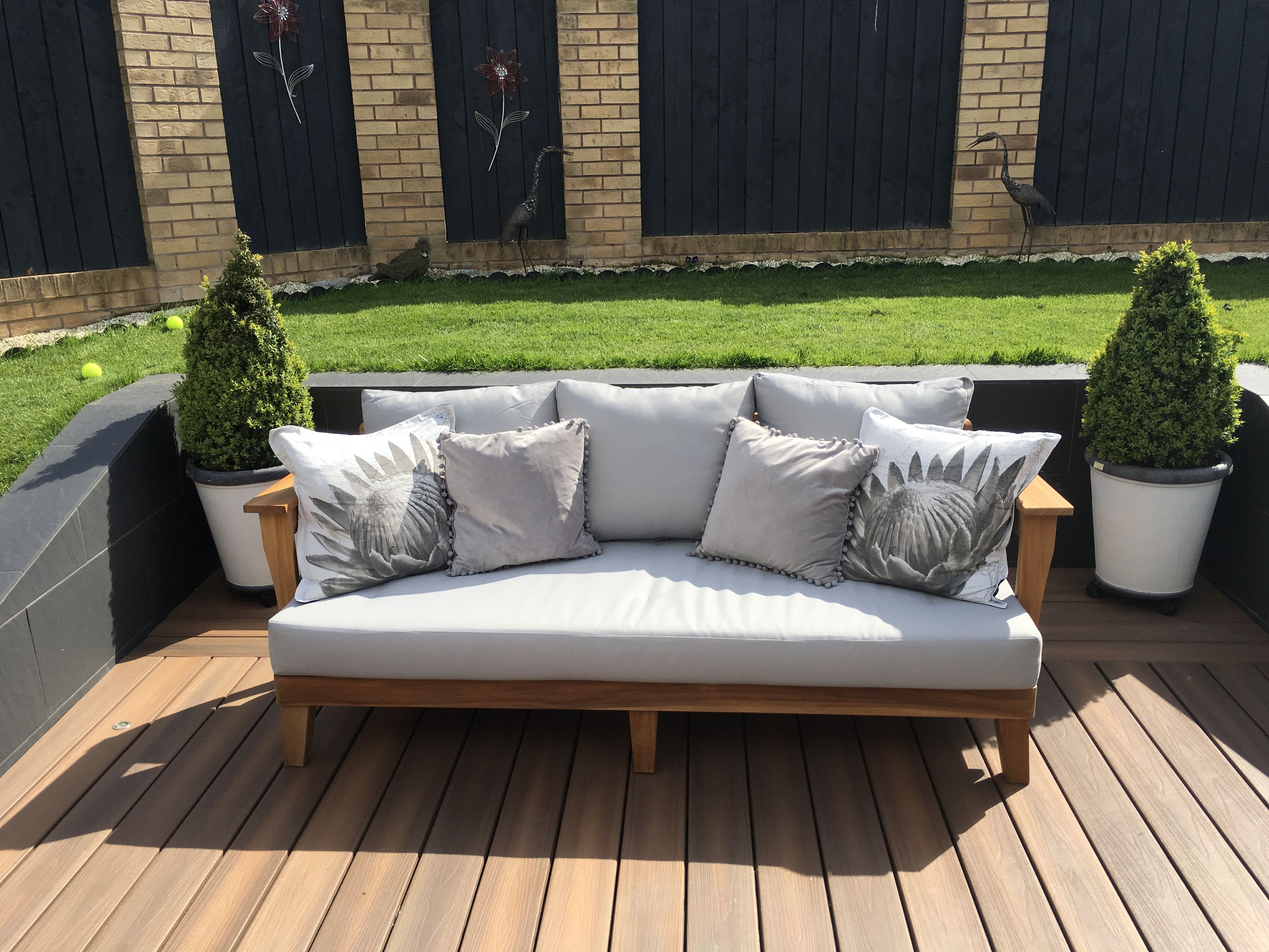 Create A Cozy Outdoor Seating Area With A Teak Sofa